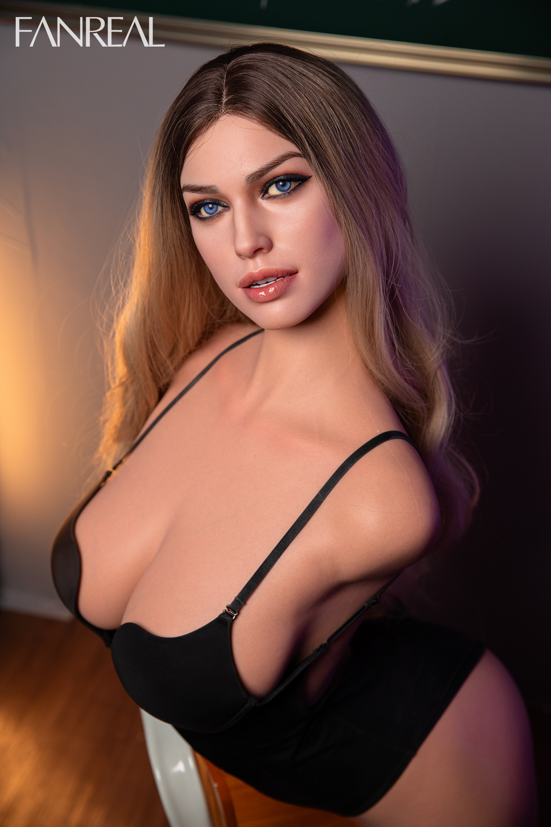 FANREAL Doll T111 cm F Silicone Torso – Della with long blonde hair, wearing a black low-cut bodysuit, showcasing realistic facial details and soft silicone skin texture.