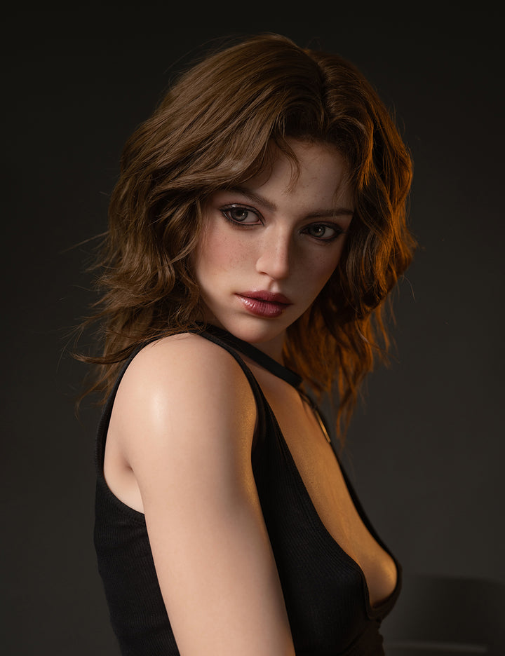 TOP-CYDOLL 172 cm A-cup Isabella realistic silicone doll with shoulder-length brown hair, wearing a black outfit, posed against a dark background.