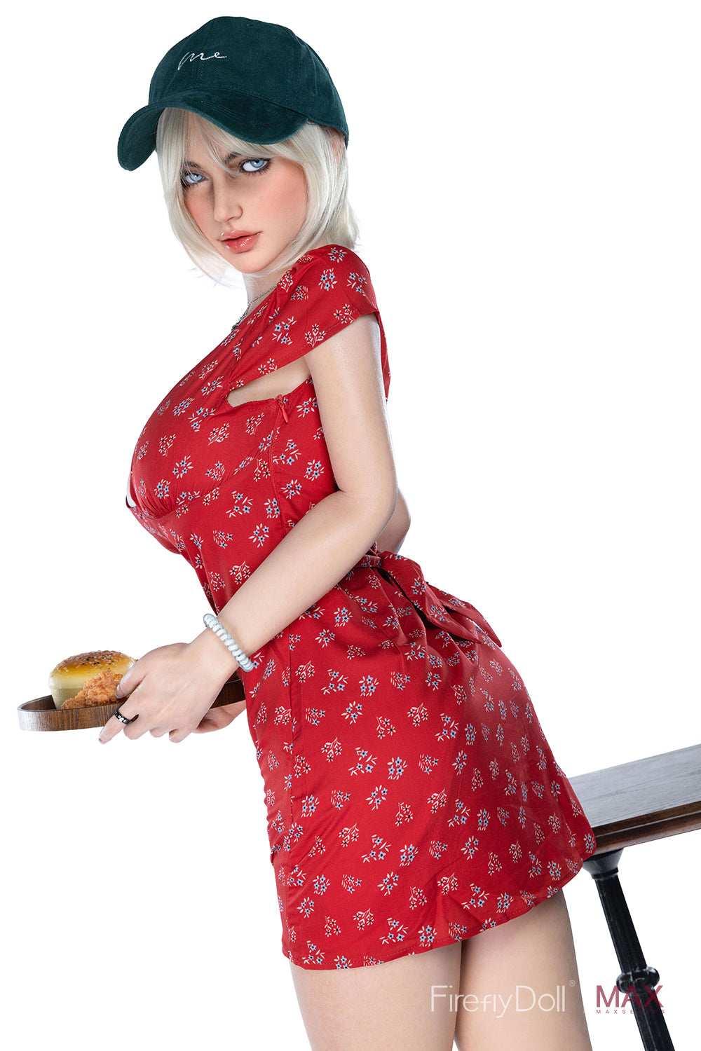 Firefly Doll 160 cm Max Series Silicone - Mary, shown from a side angle in a red floral dress, leaning forward while holding a tray.