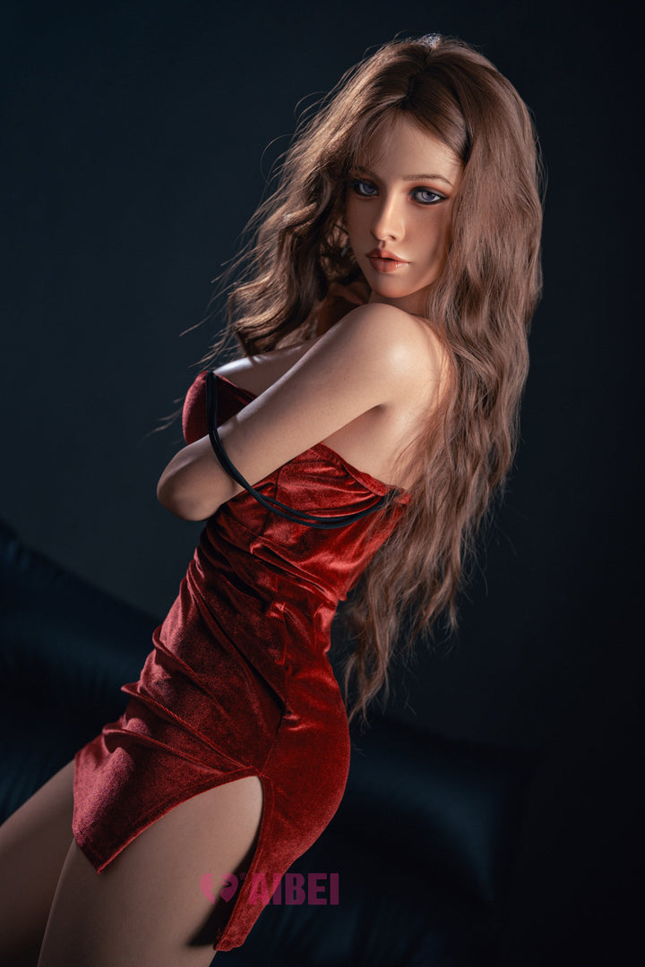 Side-angled view of the Aibei Doll 150 cm F Luxe Silicone - Grace in a red velvet dress with a side slit.