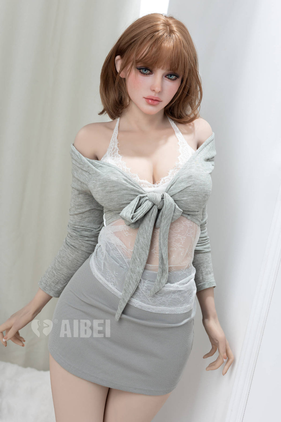Aibei Doll 159 cm D TPE - #AB34 Maresa – three-quarter view in grey cardigan and fitted mini skirt