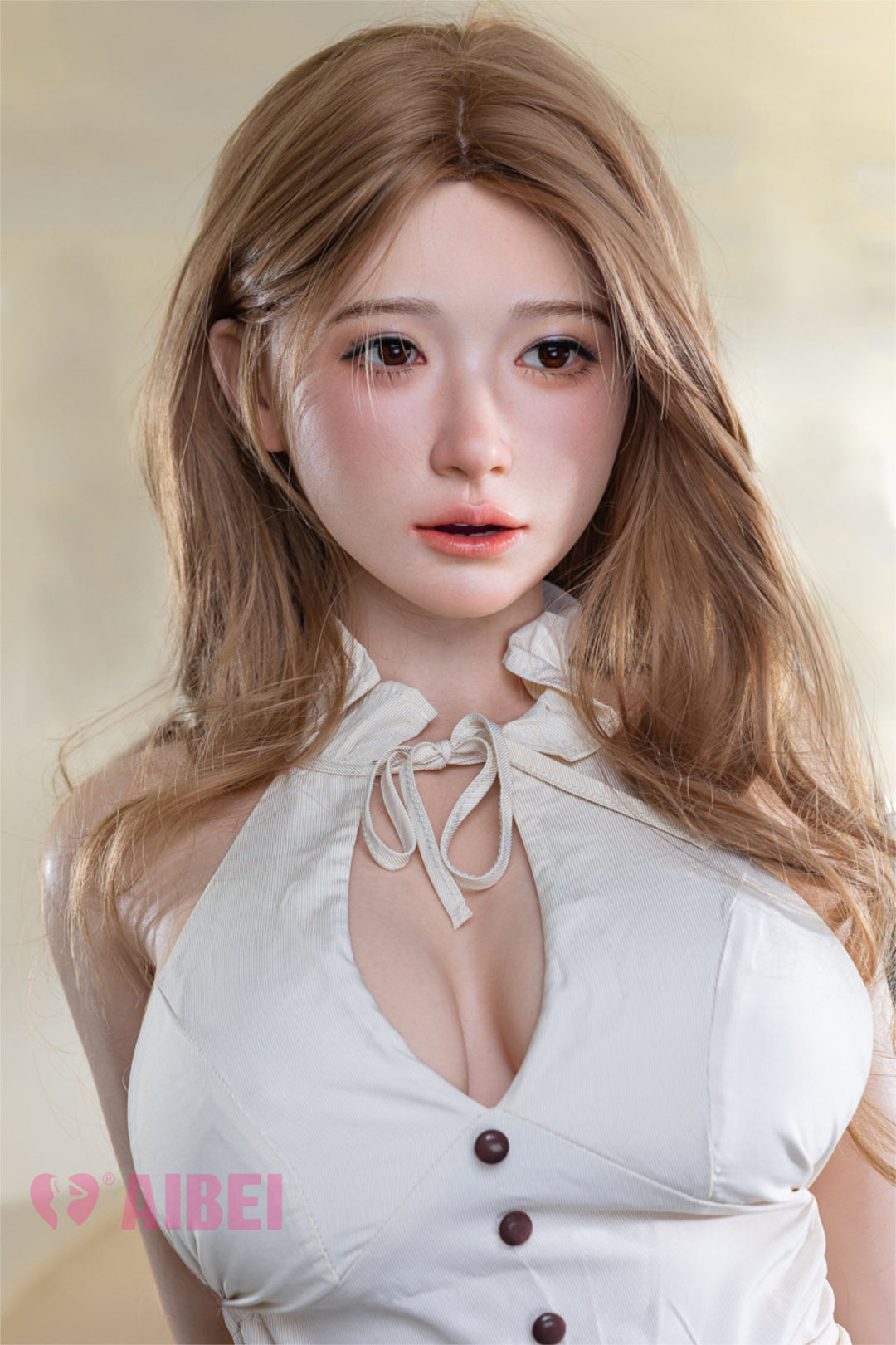 Aibei Doll 167cm E Luxe Silicone - Yuna – Close-up pose, white halter top with tie-neck detail and button front, long wavy caramel-brown hair falling past the shoulders, soft warm-toned indoor backdrop.