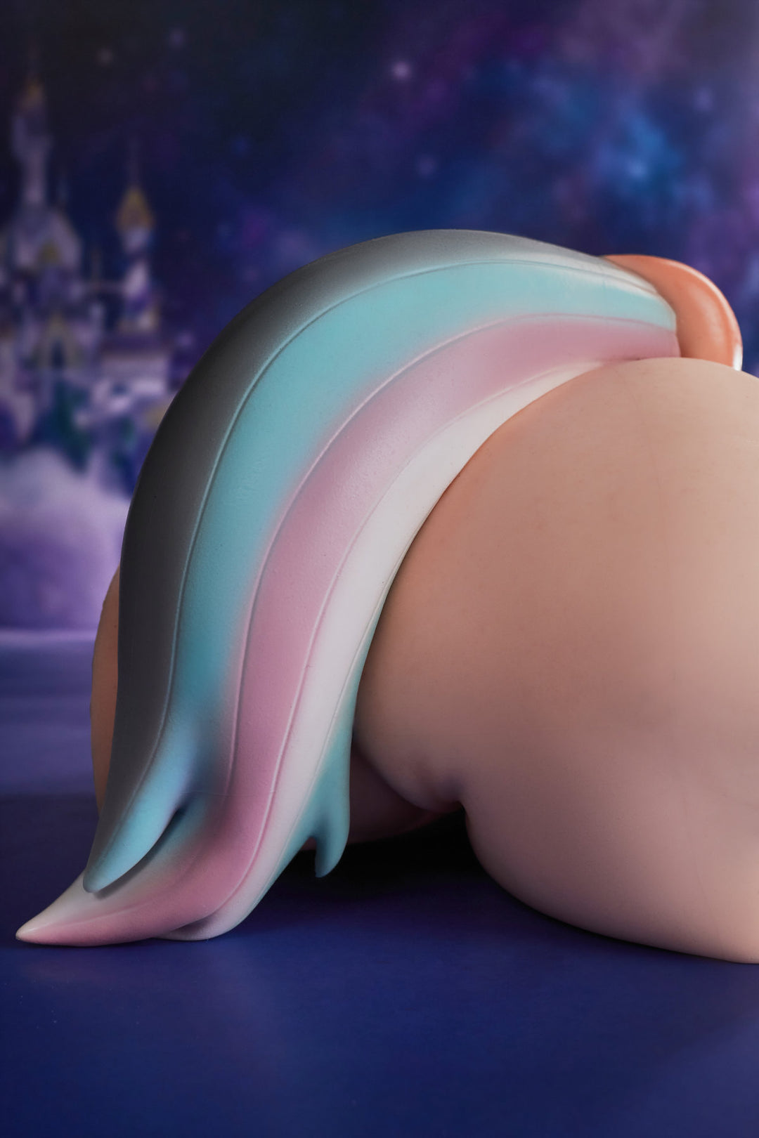 CLIMAX DOLL - PA-Razor Silicone Butt Torso (Cinnamon) side view showing torso profile with teal and pink tail accessory, galaxy blue background