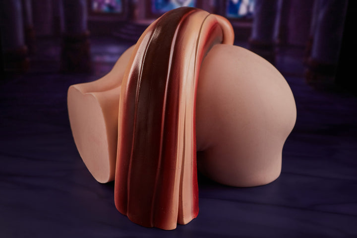 CLIMAX DOLL - PA-Theory Silicone Butt Torso (Cinnamon) close-up view showing vaginal opening detail with orange tail accessory, cathedral background