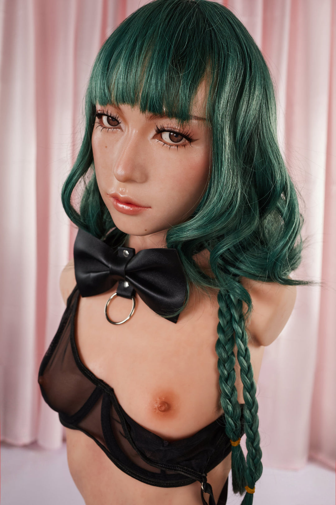 A close-up front view of the CLIMAX DOLL - ULW 881# Silicone Torso - Mayu (Natural), featuring a doll with green hair and braids, wearing a black leather bow collar and a sheer black bralette.