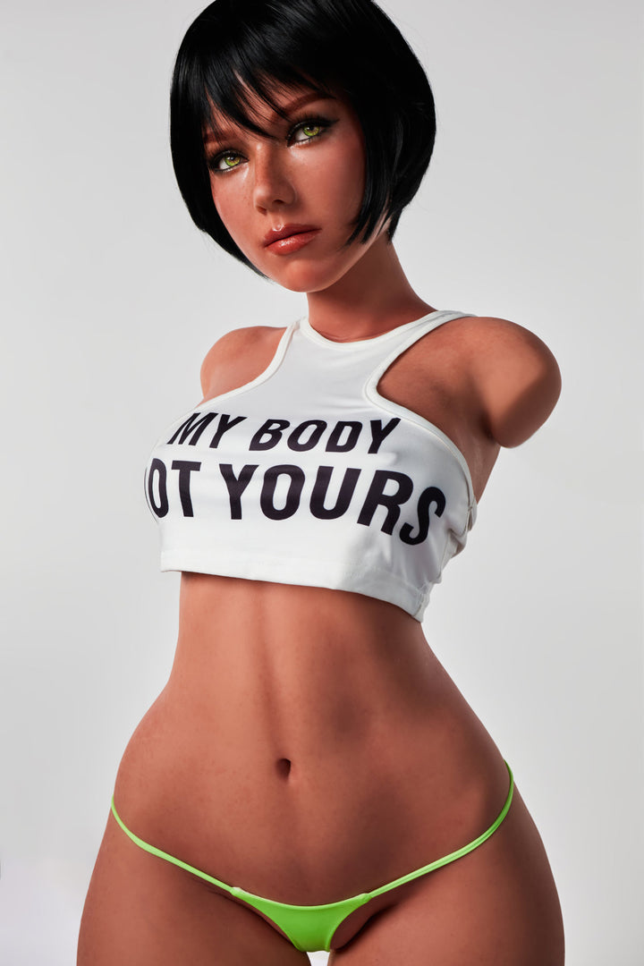 An angled, full-torso shot of the CLIMAX DOLL - ULW 882# Silicone Torso - Livia (Black) wearing the white text-print crop top and neon green bikini bottoms.