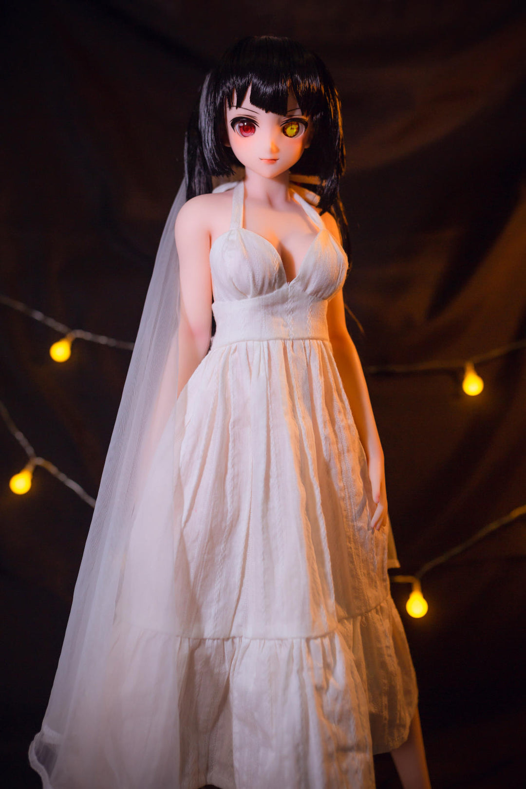 CLIMAX DOLL Mini J60 cm Hybrid - Kurumi (Cinnamon) - Front-facing full-body pose, hands at her sides, white chiffon gown with long veil and loose black hair, soft glowing lights.