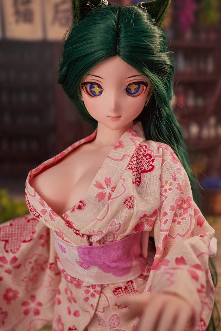 CLIMAX DOLL Mini J60cm Hybrid - Momo (Cinnamon) standing in a pink floral kimono, teal-green hair, hand extended, brick wall alley backdrop