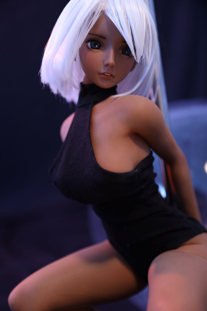 CLIMAX DOLL Mini J60 cm Hybrid - Shirley (Suntan) – kneeling pose in black bodysuit under violet light