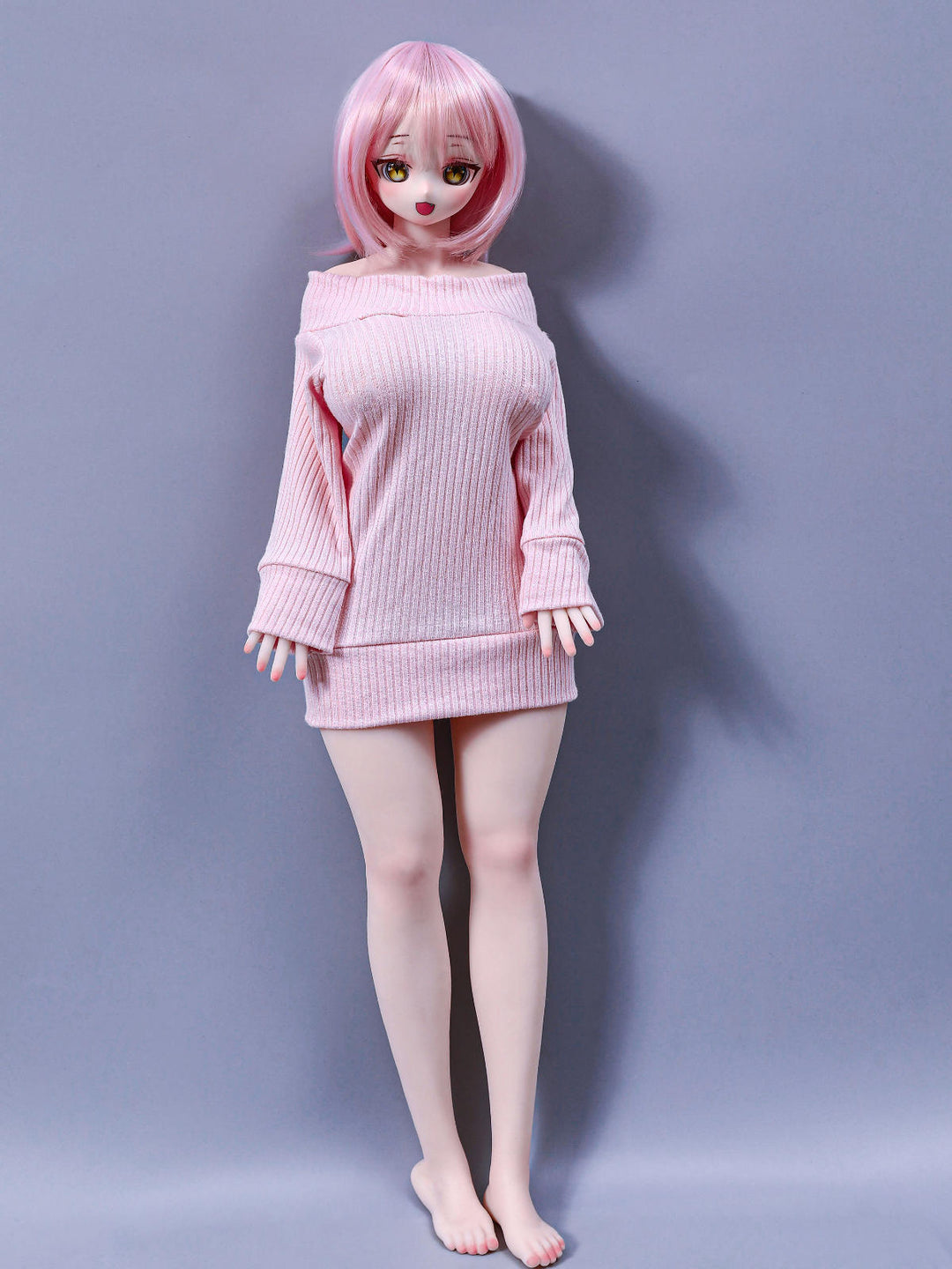 CLIMAX DOLL Mini J60cm P Hybrid - Azami (Cinnamon) full-body standing pose in an oversized pale pink knit sweater dress slipping off one shoulder, short pink bob with bangs, bare feet, soft lavender-gray studio backdrop