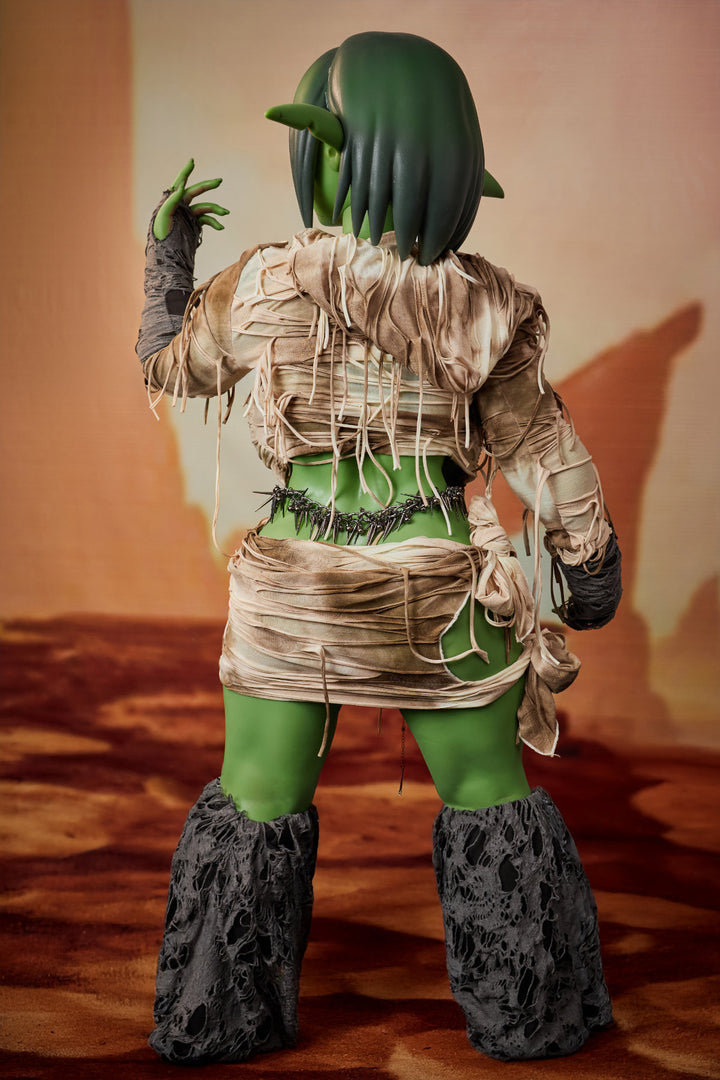 CLIMAX DOLL ULW SiF120 cm Silicone - Barza (Green) close-up upper body front view in tan wrap, short green hair, desert red background
