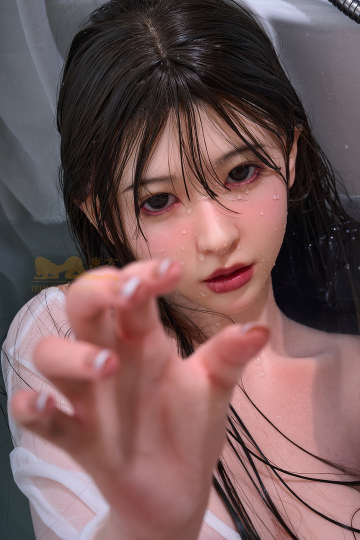 Realistic silicone doll Lina, Irontech 153 cm, with wet hair and reaching hand pose, detailed lifelike facial features.