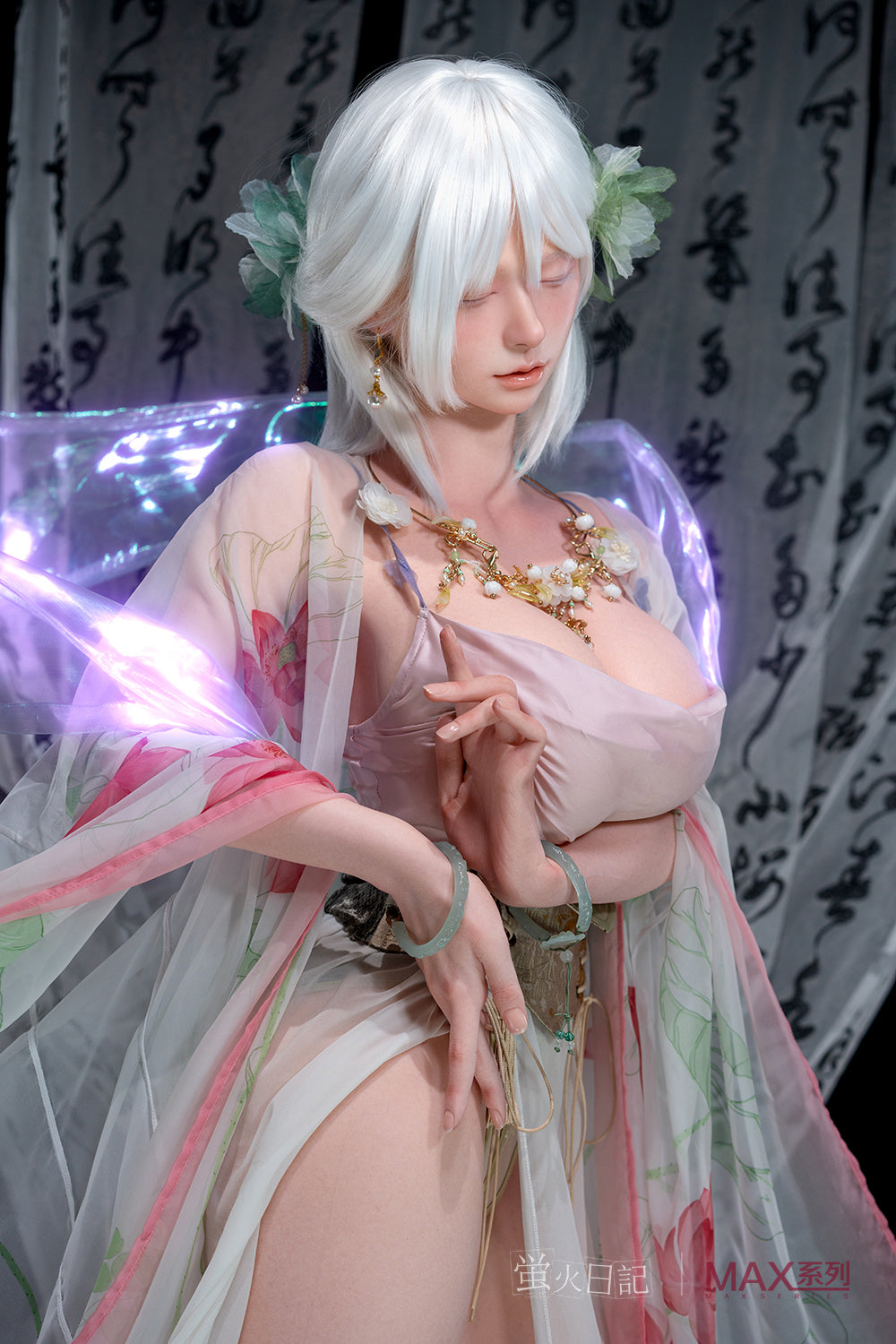 Close-up portrait of the Firefly Diary Doll 160 cm Max Series Silicone - Liu Li V3. The doll has a delicate facial expression with soft pink makeup, short white bangs, and green flower hair clips. She is adorned with an intricate gold and white floral necklace and green jade-style bangles, posed with her hands near her chest against a background of calligraphy banners.