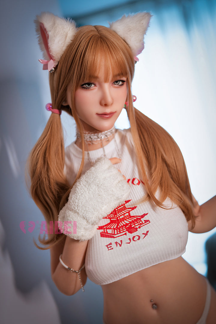 Aibei Doll 158 cm F-cup silicone model 'Rika' wearing a white crop top with red print, white mittens, and cat ears, styled in a cute anime-inspired look.