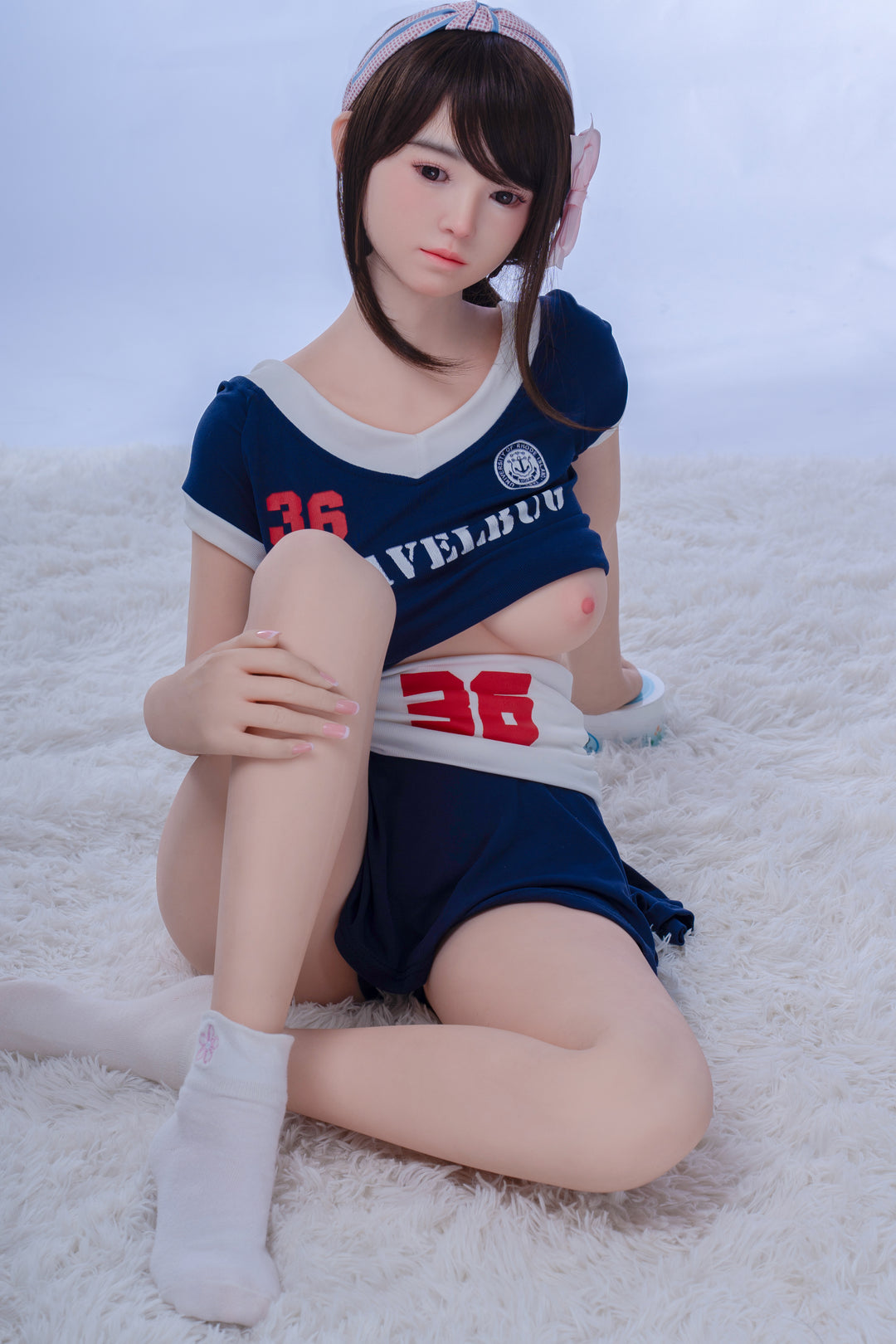 Yuki by TAYU Doll – 148 cm hybrid love doll with D-cup bust, soft silicone body, and youthful look, dressed in athletic uniform.