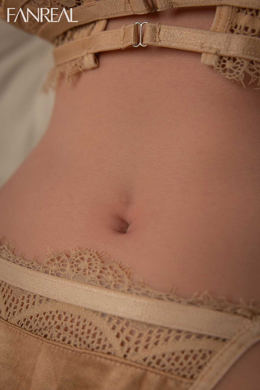 FANREAL DOLL T111 CM F Silicone Torso - Lila V4 close-up of navel and midsection framed by sexy gold lace lingerie straps.