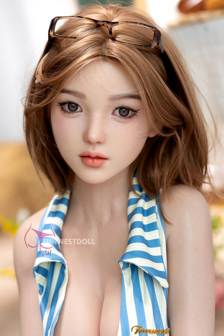 FunWest Doll 152 cm D Silicone – Asian Nika with short brown hair, sunglasses on head, and blue striped swimsuit, close-up portrait view.