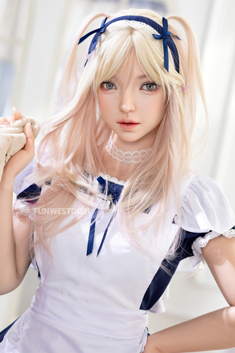 FunWest Doll 159 cm A Silicone – Giselle with realistic skin texture, featuring long blonde hair styled in pigtails with blue ribbons, wearing a white and navy maid outfit.