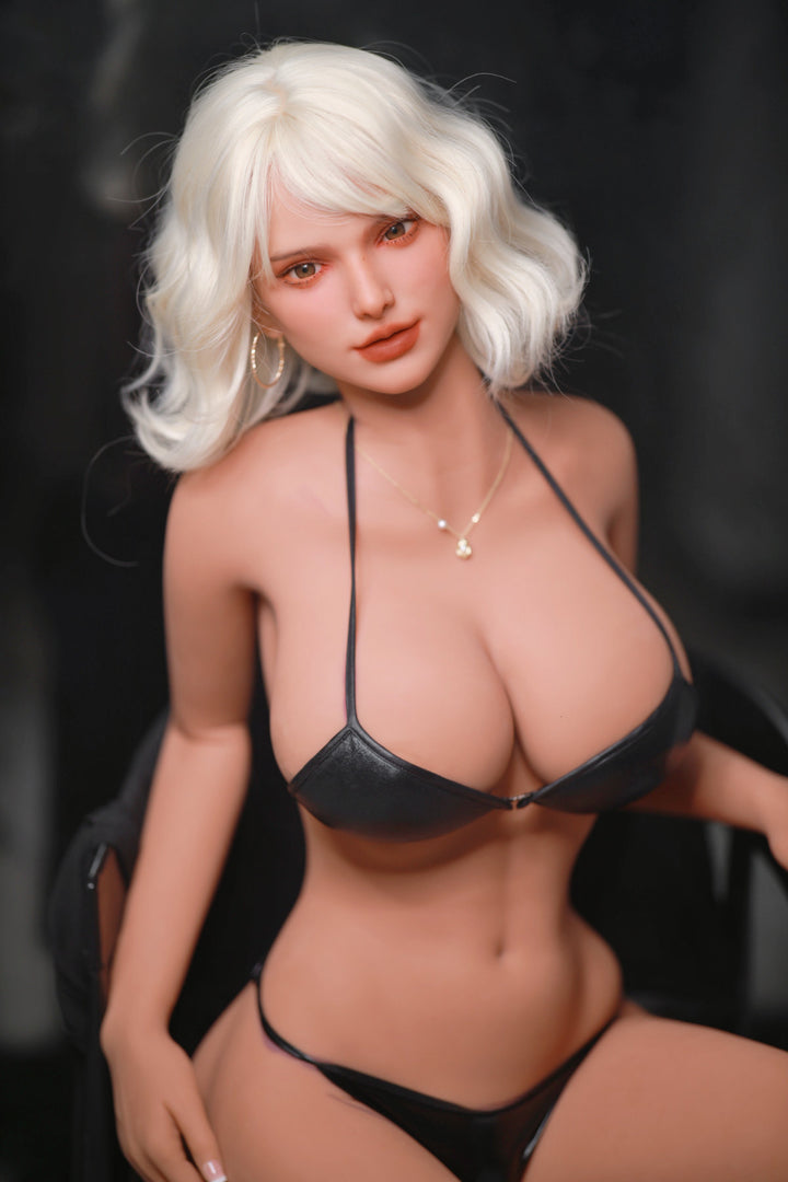 Fire Doll 166 cm E TPE - Rossi upper body front view in black bikini top and thong, short white wavy hair, dark dramatic background
