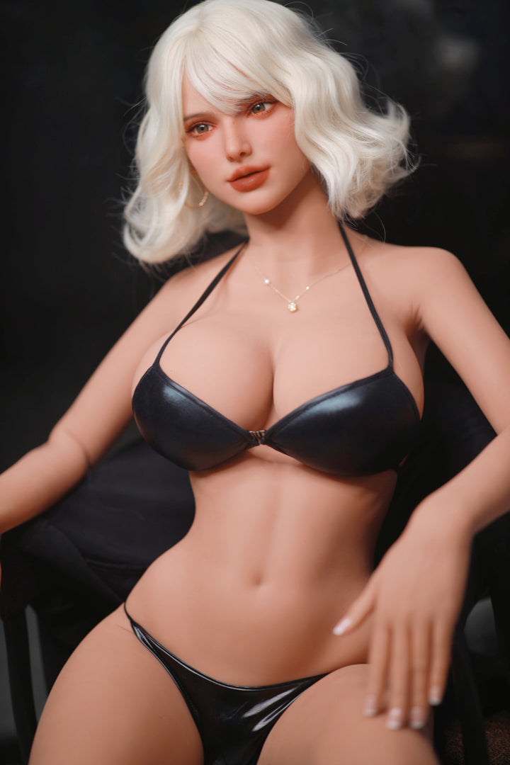 Fire Doll 166 cm E TPE - Rossi upper body side angle in black bikini top, short white wavy hair, dark dramatic background
