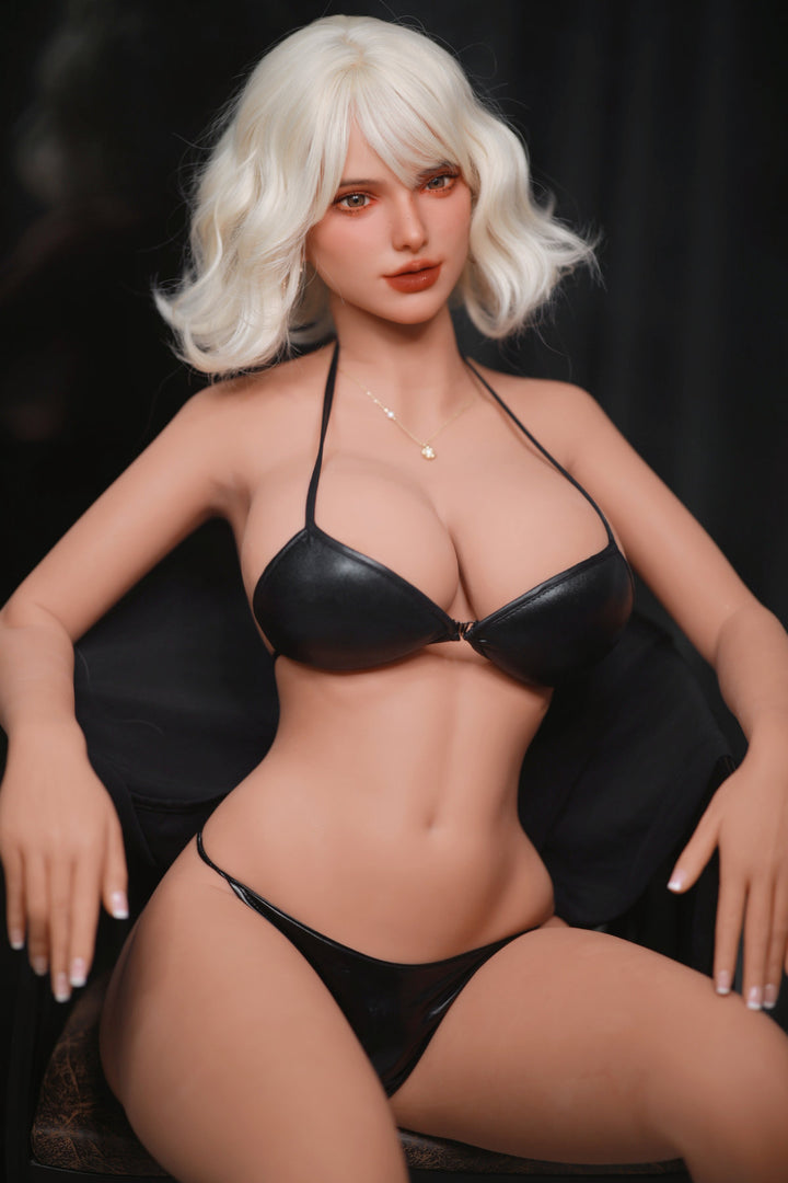 Fire Doll 166 cm E TPE - Rossi rear view in black bikini top and thong, short white wavy hair, dark dramatic background
