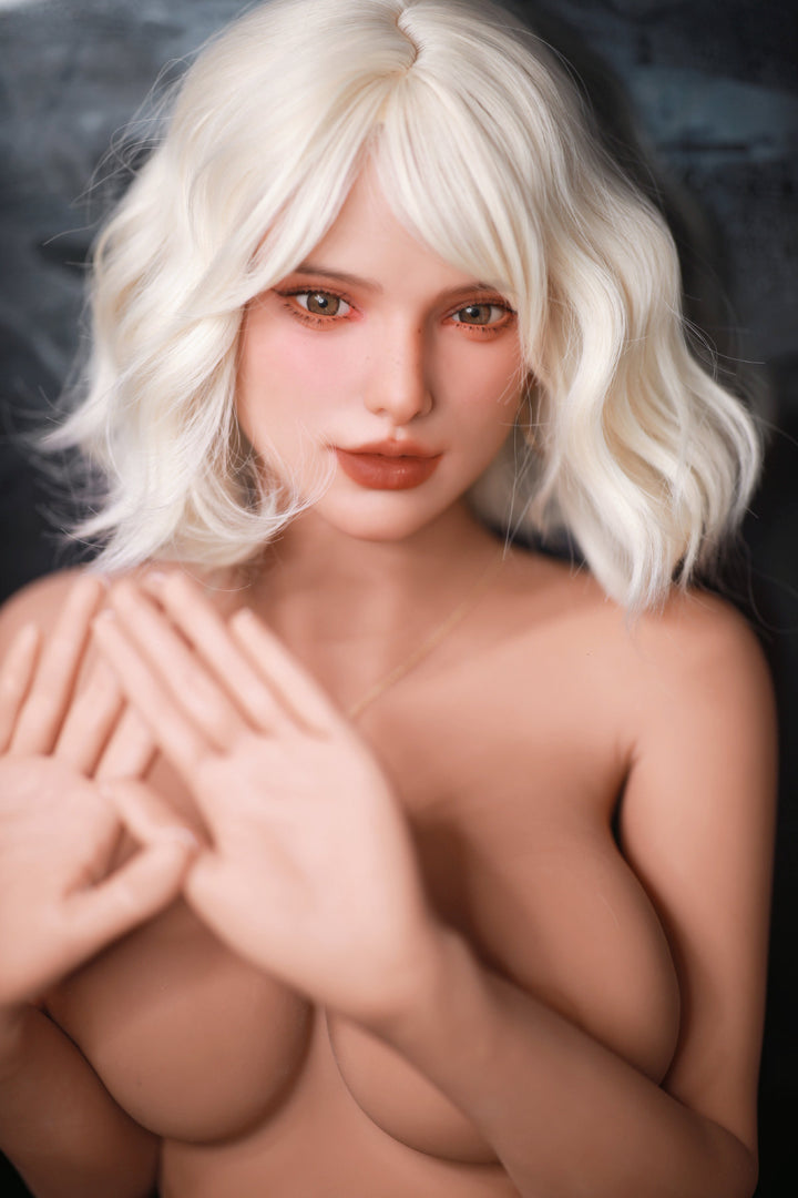 Fire Doll 166 cm E TPE - Rossi close-up front view in black bikini top, short white wavy hair, dark dramatic background
