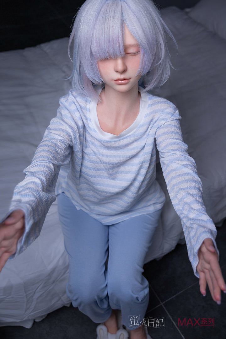 Firefly Diary Doll 153 cm A Max Series Silicone - Liuli V2 with light purple hair wearing a striped shirt and jeans sitting on a bed.