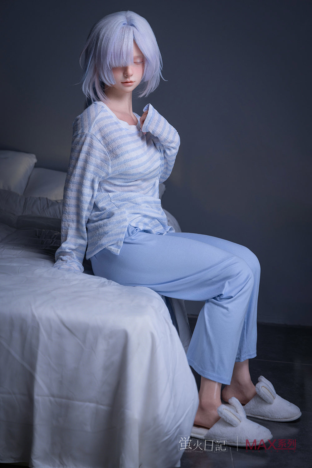 Firefly Diary Doll 153 cm A Max Series Silicone - Liuli V2 in light blue pajama set sitting on a bed with a dark background