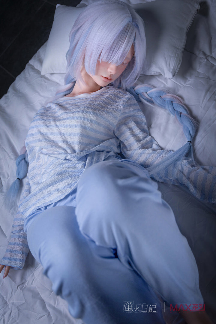 Firefly Diary Doll 153 cm A Max Series Silicone - Liuli V2 lying in a bed with white sheets.