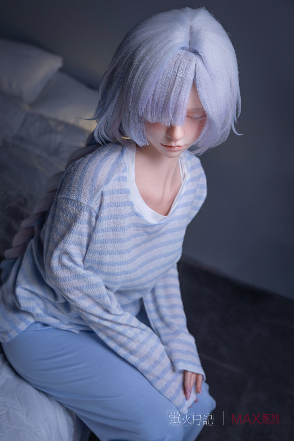 Firefly Diary Doll 153 cm A Max Series Silicone - Liuli V2 wearing a light blue striped shirt and pants sitting on a bed.