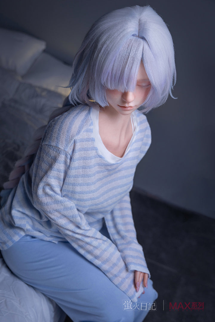 Firefly Diary Doll 153 cm A Max Series Silicone - Liuli V2 wearing a light blue striped shirt and pants sitting on a bed.