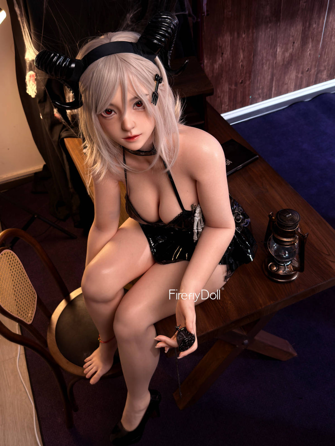 Firefly Diary Doll 159 cm Silicone - Caicaizi – perched on a wooden chair in black latex, long blonde hair over her shoulders