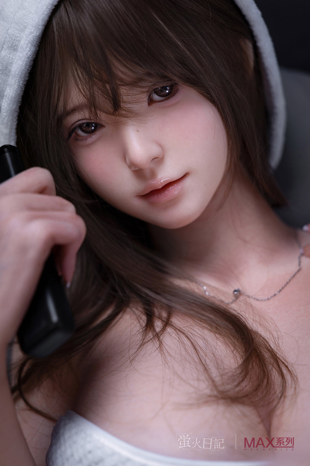 Firefly Diary Doll 160 cm Max Series Silicone - Little Leeson with long brown hair holding a hair dryer, wearing a white towel around her hair.