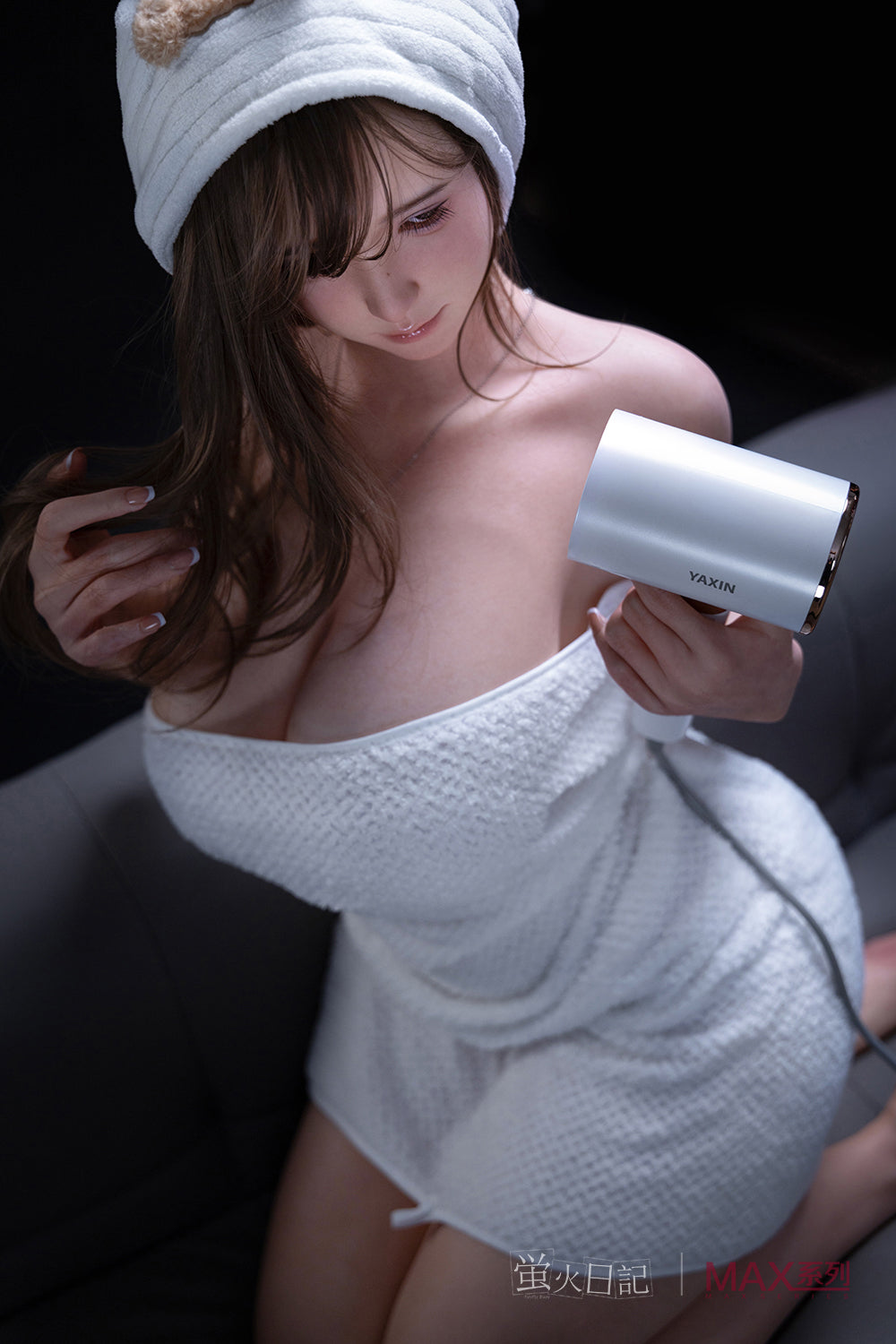 Firefly Diary Doll 160 cm Max Series Silicone - Little Leeson holding a hair dryer with a towel on her head.