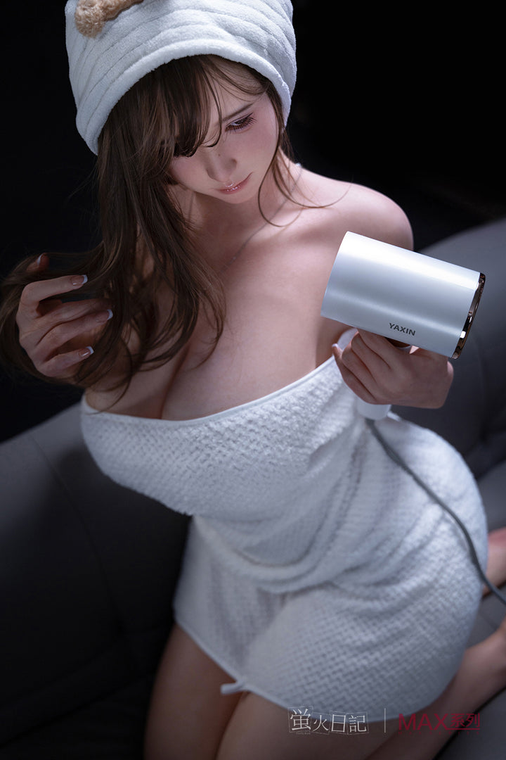 Firefly Diary Doll 160 cm Max Series Silicone - Little Leeson holding a hair dryer with a towel on her head.