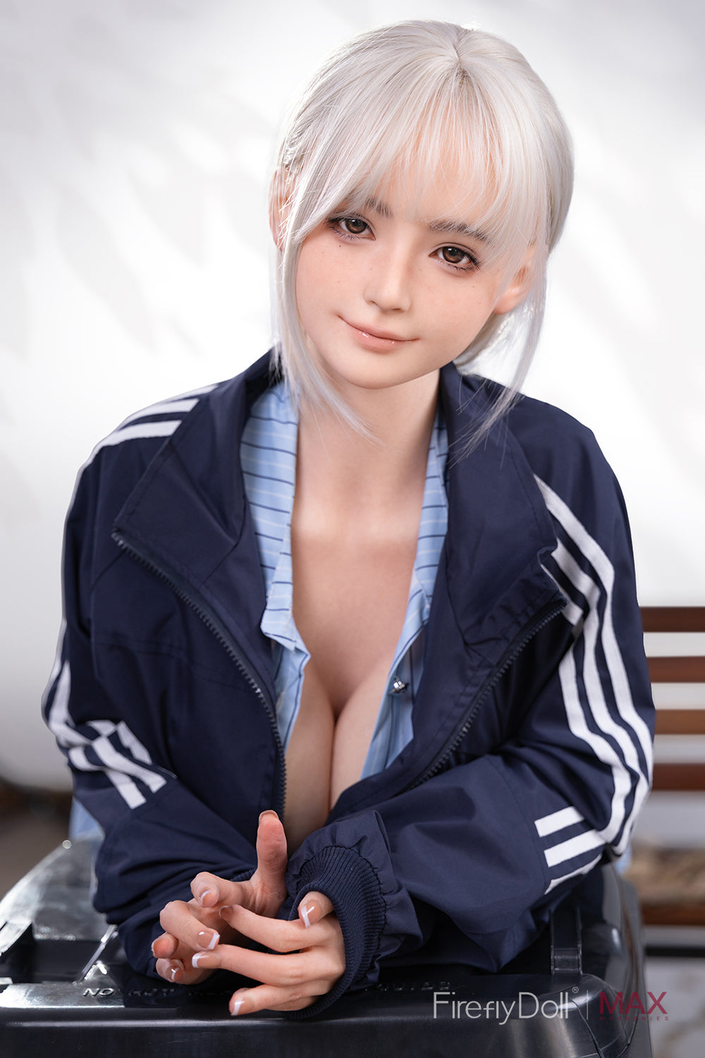 Firefly Diary Doll 160 cm Max Series Silicone - Qiandao V4 wearing a blue tracksuit with white stripes, sitting on a chair.