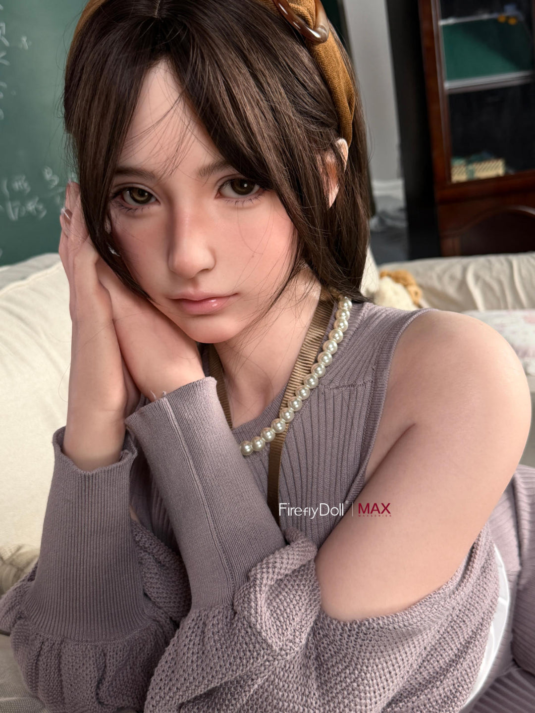 Firefly Diary Doll 165 cm B Max Series Silicone - Haruko V2 seated portrait in a gray knit sweater dress, pearl necklace, dark auburn wavy bob, cozy interior backdrop