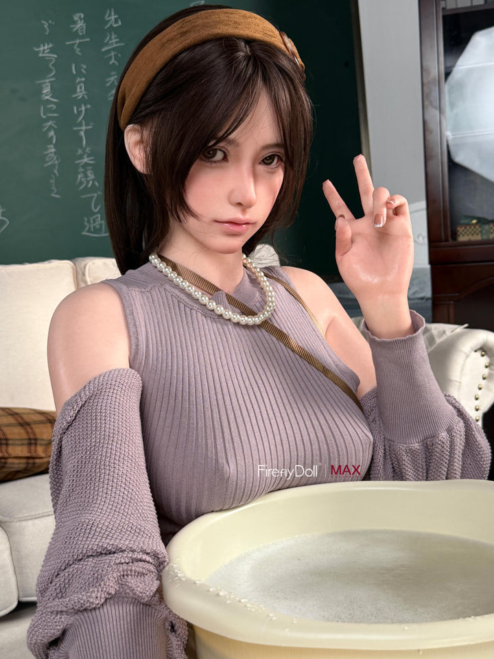 Firefly Diary Doll 165 cm B Max Series Silicone - Haruko V2 seated close-up in a gray knit sweater dress, pearl necklace visible
