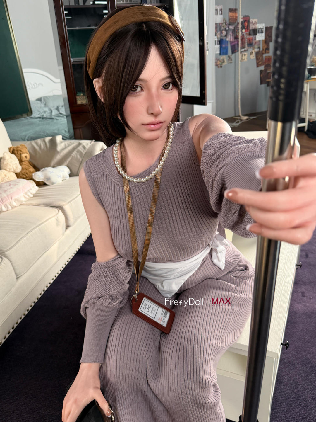 Firefly Diary Doll 165 cm B Max Series Silicone - Haruko V2 seated close-up in a gray knit sweater dress, cream couch backdrop