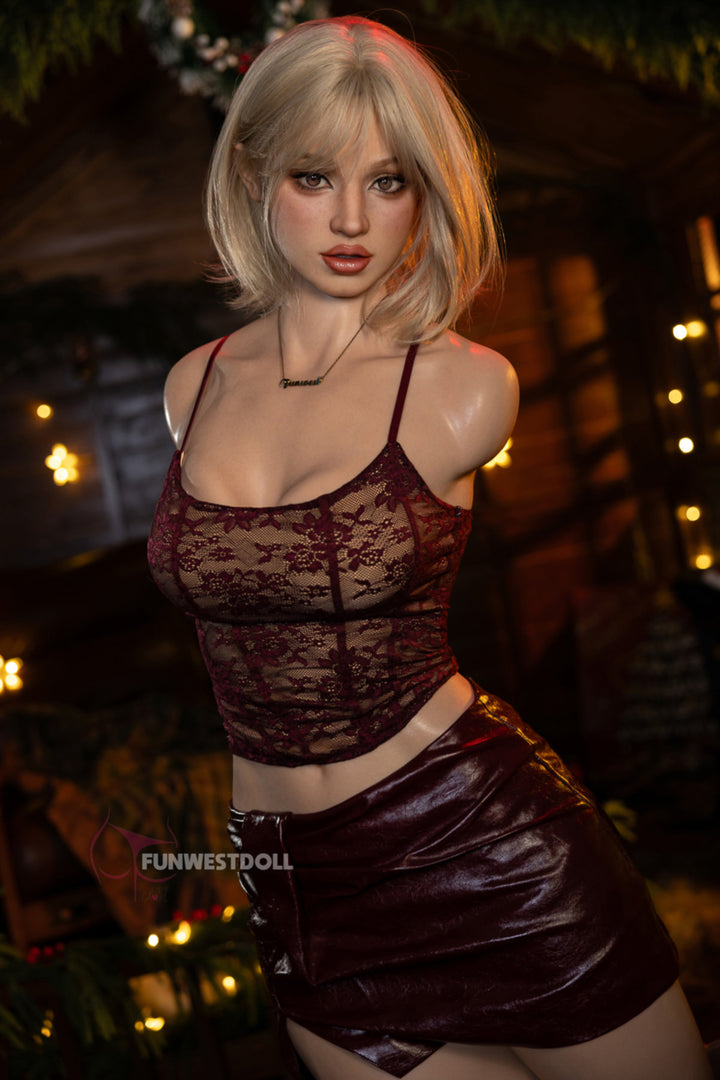 FunWest Doll 113 cm D FWT Series Silicone Torso - Lyra V2 three-quarter view in red lace crop top and burgundy mini skirt, short blonde bob hair, festive Christmas background
