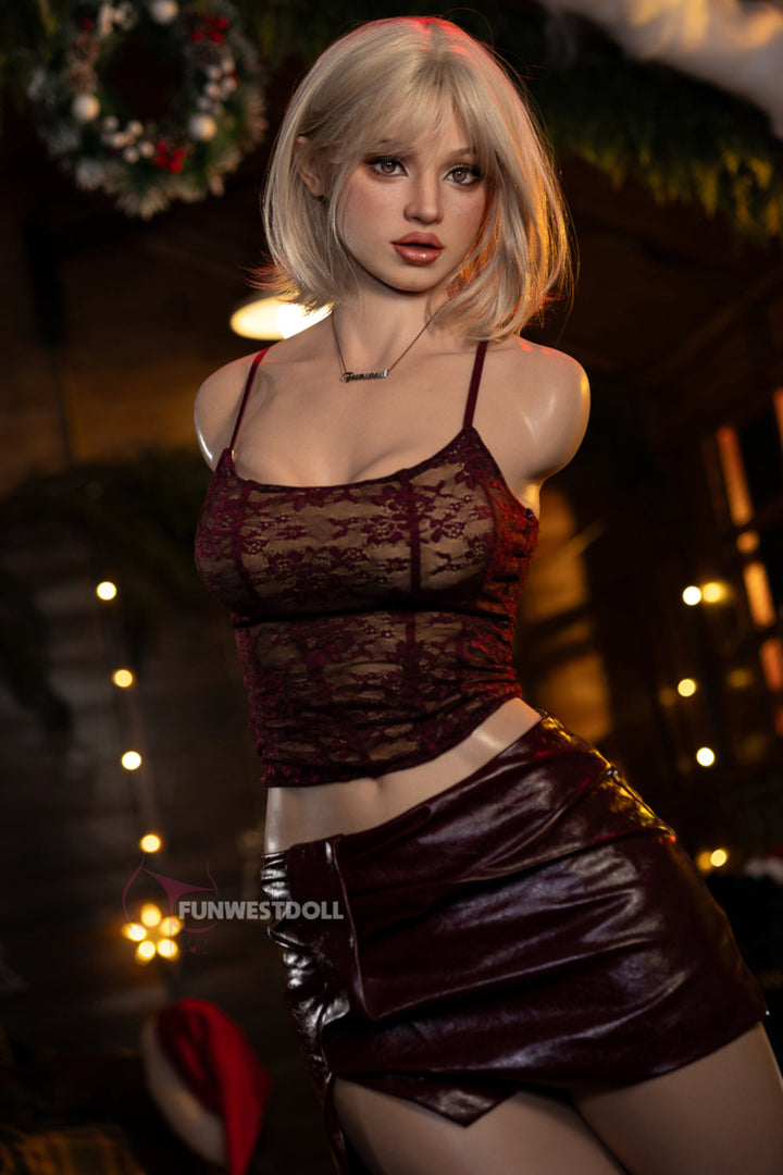 FunWest Doll 113 cm D FWT Series Silicone Torso - Lyra V2 full body standing front view in red lace crop top and burgundy mini skirt, short blonde bob hair, festive Christmas background

