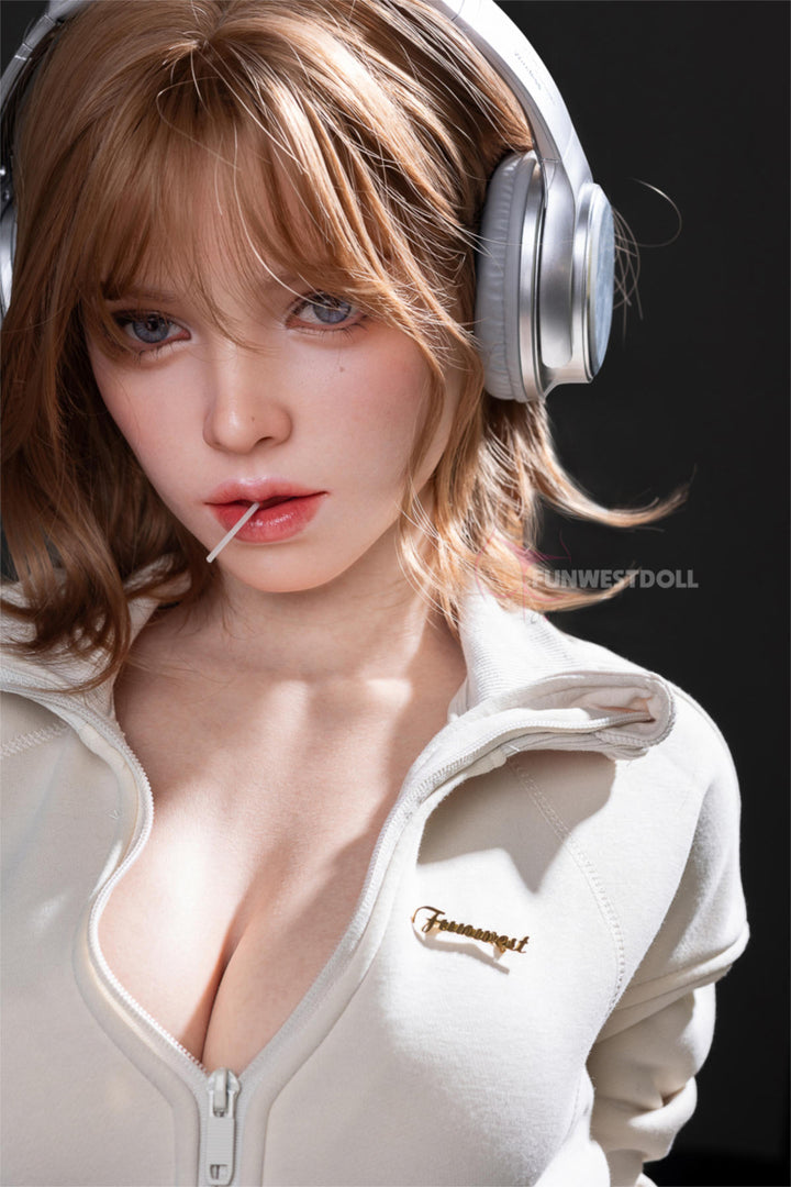 FunWest Doll 152 cm D Silicone - Thalia (Real Skin Texture) – close-up with headphones on and hoodie unzipped, showing her D-cup bust