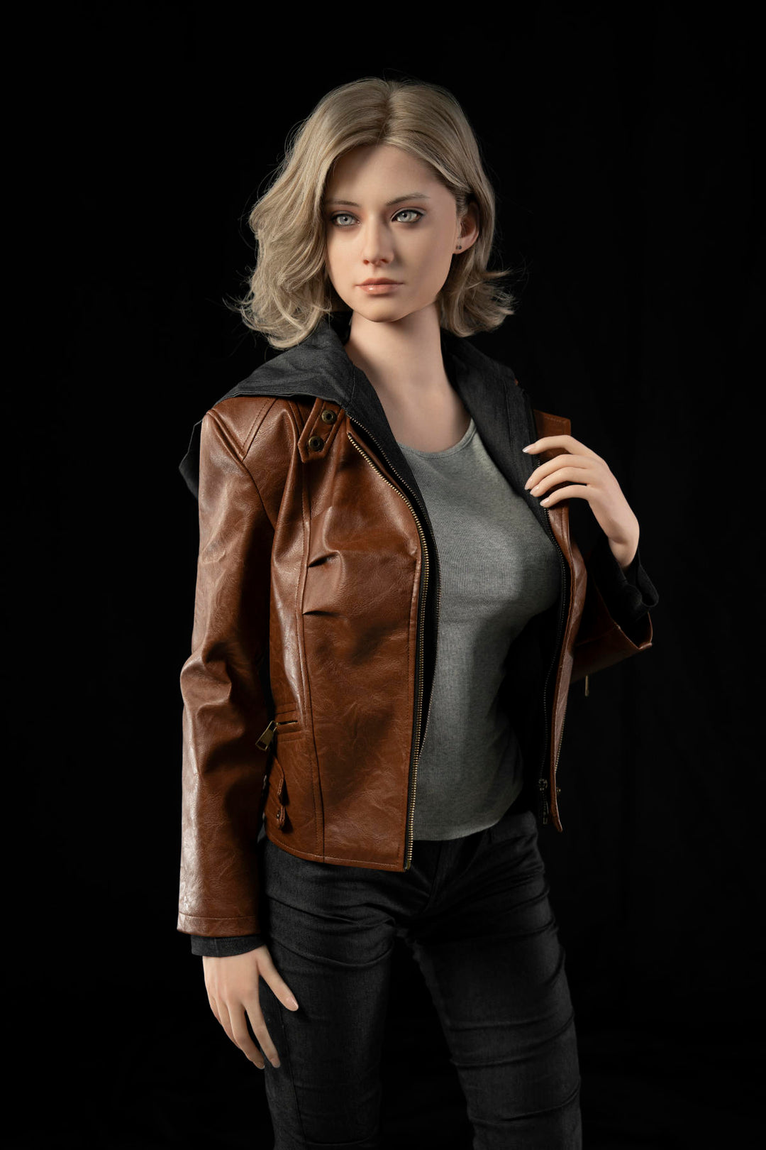 Game Lady 166 cm E Silicone - Grace – full-length standing pose in a leather jacket, grey tee and black jeans