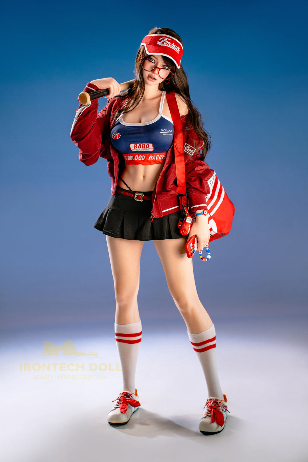 Irontech Doll 161 CM F Silicone - Evie full body side view in red jacket draped over blue racing outfit, showcasing realistic silicone figure craftsmanship against blue studio background