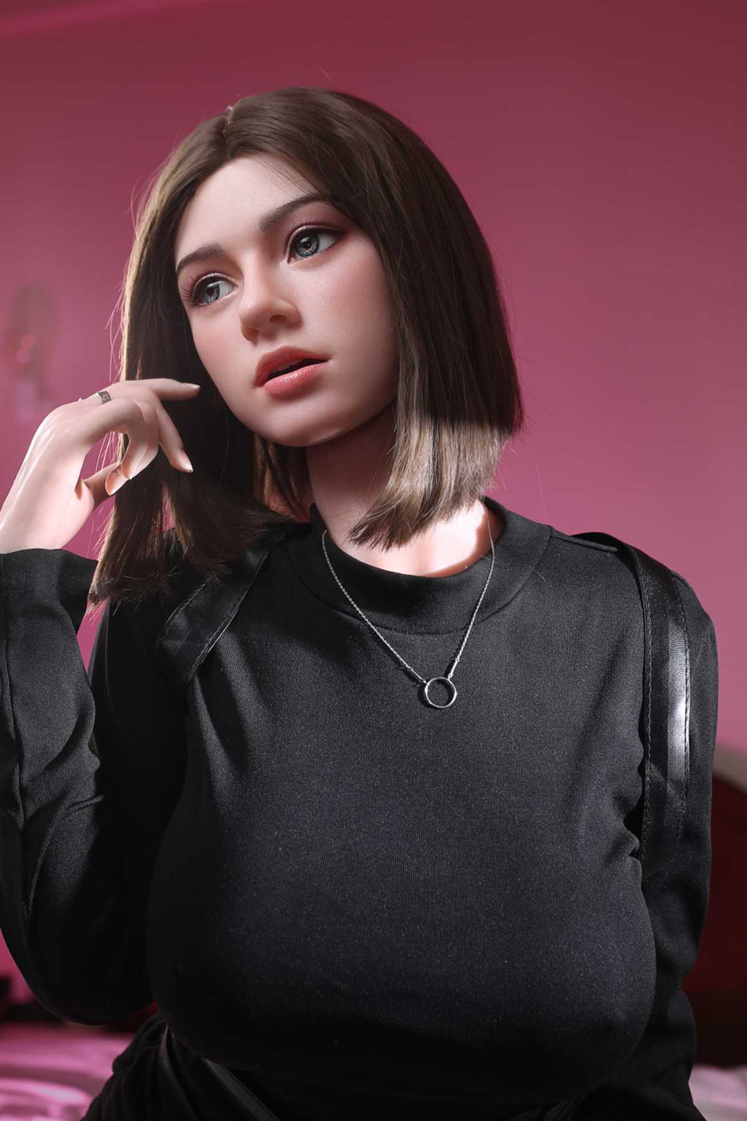 JX Doll 170 cm D Hybrid - M12 wearing a black outfit with a pink background