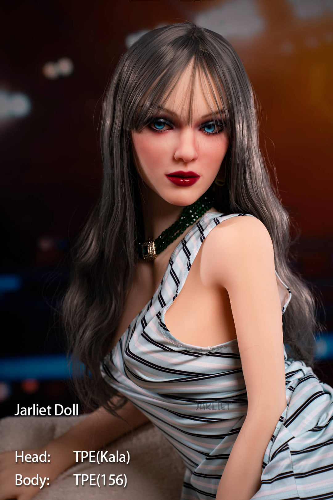 Jarliet Doll 156 cm B TPE - Kala V2 close-up torso shot in the striped playsuit, warm stadium-light backdrop
