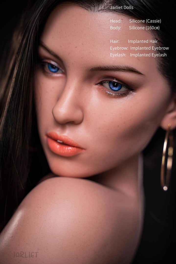 Jarliet Doll 160 cm C Silicone - Cassie close-up portrait, striking blue eyes, wavy dark hair, dark studio backdrop