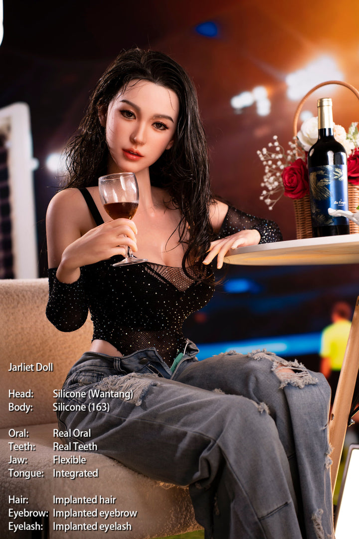Jarliet Doll 163 cm D Silicone - Wantang seated holding a drink, black lace top and ripped jeans, warm string-light backdrop