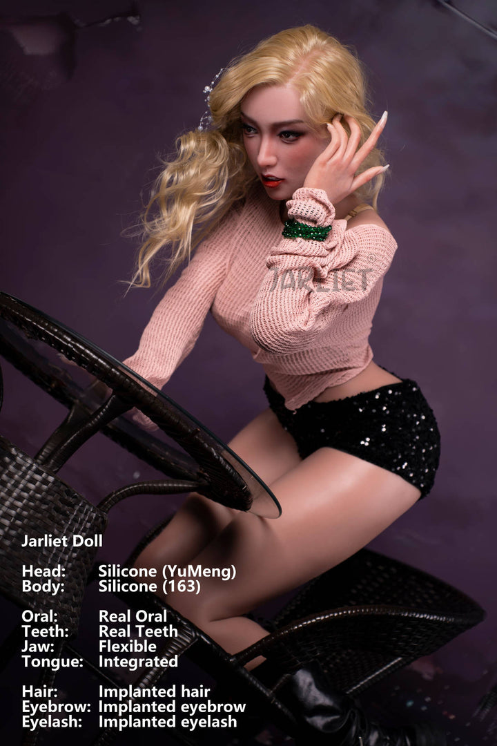 Jarliet Doll 163 cm D Silicone - YuMeng seated pose in the pink sweater and black skirt at a different angle, purple backdrop