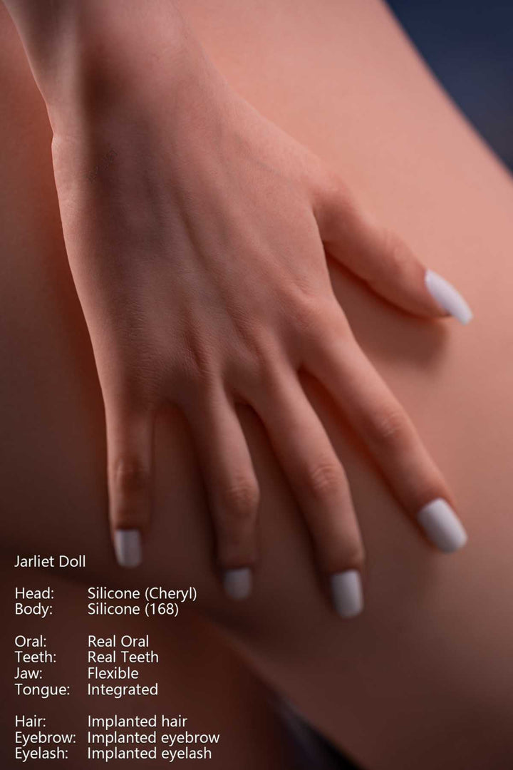 Jarliet Doll 168 cm D Silicone - Cheryl Close-up of hand details painted with white nails resting on skin, soft blue background.